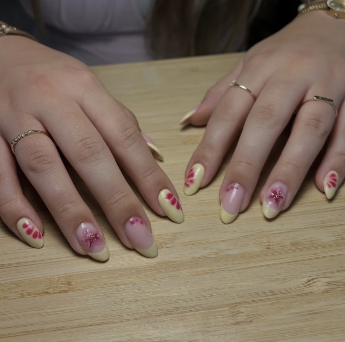 Pastel yellow nails with pink 3D flower art